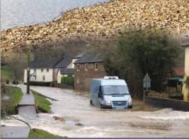 Van driving through flood water