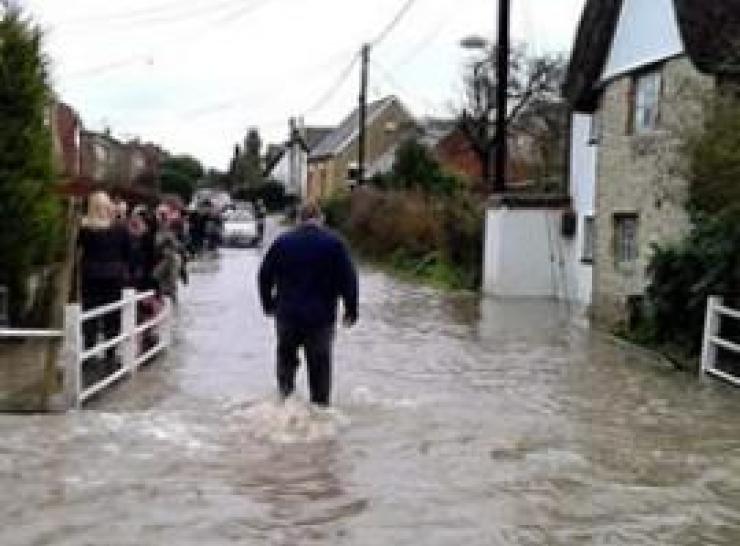 Man walking through flood